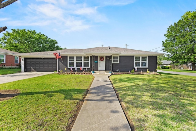 1701 W Birge St, Sherman, TX 75092 - single story home featuring a garage, a front lawn, concrete driveway, and brick siding