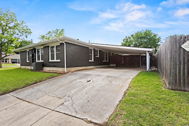 1701 W Birge St, Sherman, TX 75092 - view of front of property featuring brick siding, concrete driveway, central AC unit, and a carport