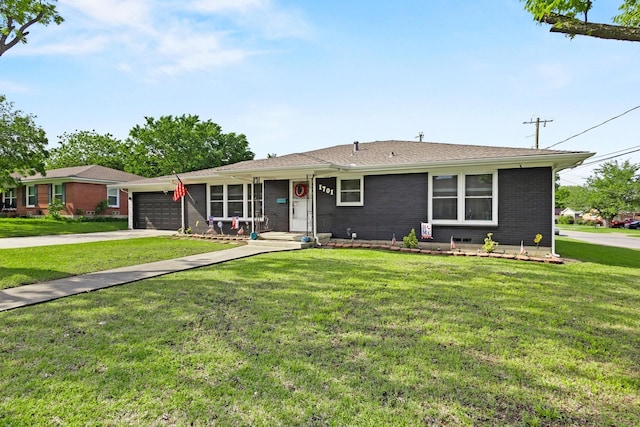 1701 W Birge St, Sherman, TX 75092 - ranch-style home with a garage, driveway, a front yard, and brick siding