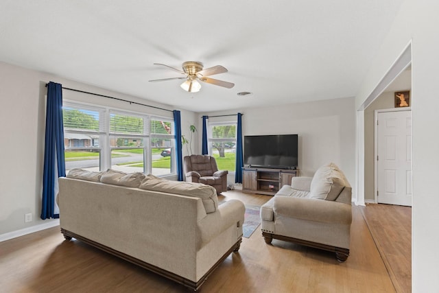 1701 W Birge St, Sherman, TX 75092 - living area featuring ceiling fan, light wood-type flooring, and baseboards