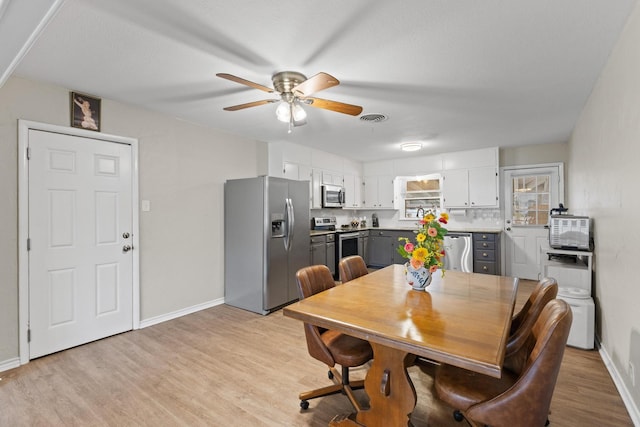 1701 W Birge St, Sherman, TX 75092 - dining room with a ceiling fan, light wood-style floors, and baseboards