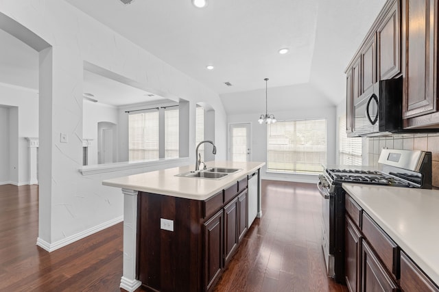 1716 Yarmouth Ln, Mansfield, TX 76063 - kitchen with dark wood-style flooring, stainless steel appliances, light countertops, and a sink