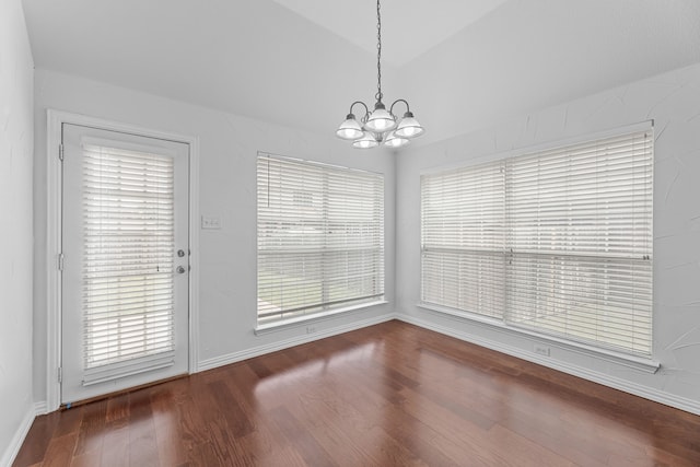 1716 Yarmouth Ln, Mansfield, TX 76063 - unfurnished dining area with wood finished floors, a notable chandelier, and baseboards