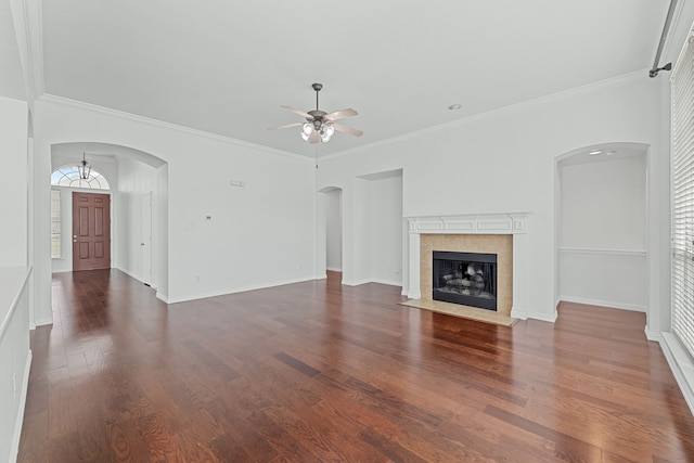 1716 Yarmouth Ln, Mansfield, TX 76063 - unfurnished living room with dark wood finished floors, a tile fireplace, baseboards, a ceiling fan, and crown molding
