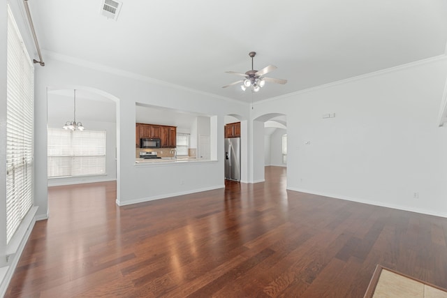 1716 Yarmouth Ln, Mansfield, TX 76063 - unfurnished living room featuring arched walkways, ornamental molding, ceiling fan with notable chandelier, visible vents, and dark wood-type flooring
