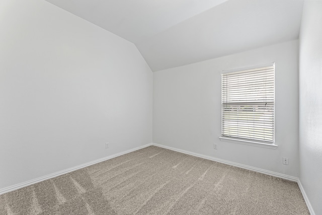 1716 Yarmouth Ln, Mansfield, TX 76063 - carpeted empty room with vaulted ceiling and baseboards