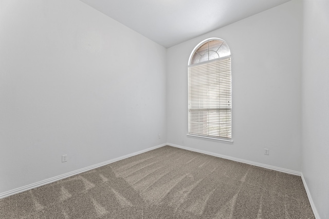 1716 Yarmouth Ln, Mansfield, TX 76063 - carpeted spare room with vaulted ceiling and baseboards