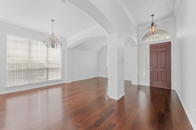 1716 Yarmouth Ln, Mansfield, TX 76063 - foyer entrance featuring arched walkways, a chandelier, ornamental molding, baseboards, and dark wood-type flooring