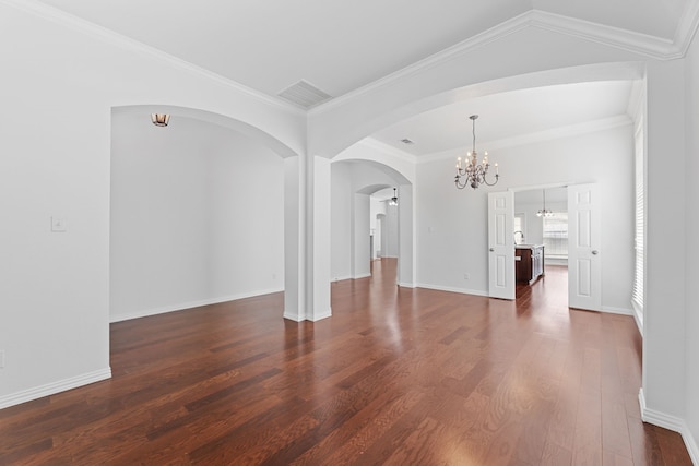 1716 Yarmouth Ln, Mansfield, TX 76063 - interior space featuring a chandelier, crown molding, visible vents, arched walkways, and dark wood finished floors