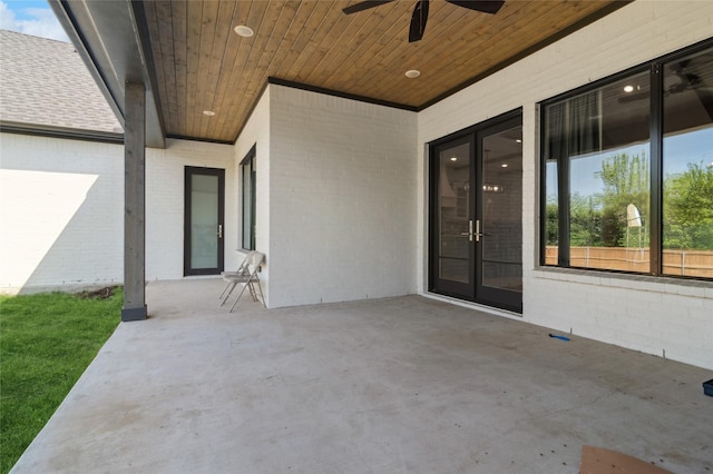view of patio / terrace featuring ceiling fan and french doors