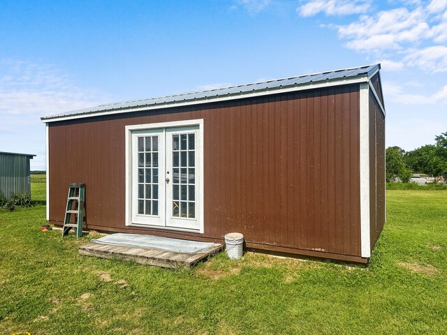 view of outbuilding featuring french doors and an outdoor structure