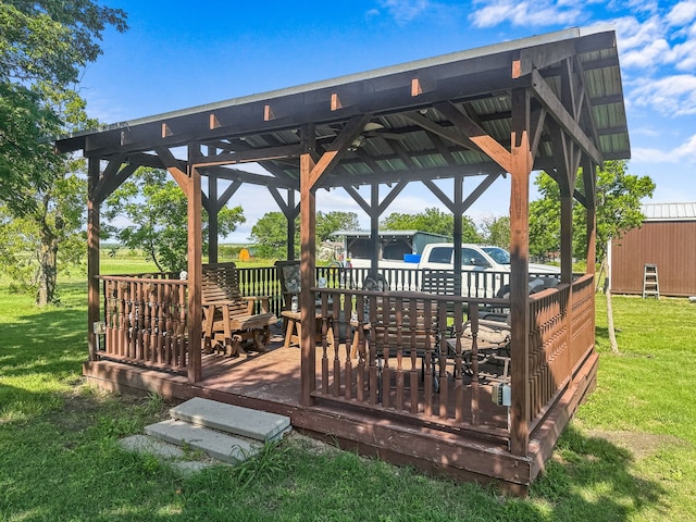 deck featuring a gazebo and a yard