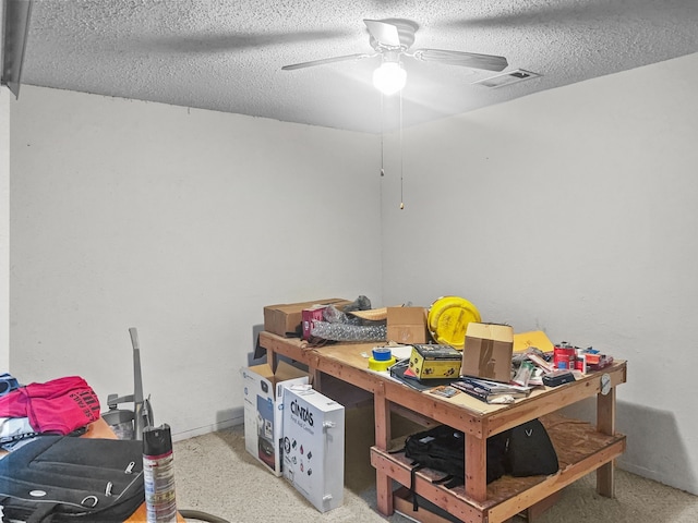 interior space featuring ceiling fan and visible vents