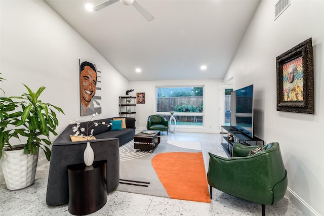 living room with lofted ceiling, visible vents, baseboards, recessed lighting, and a ceiling fan