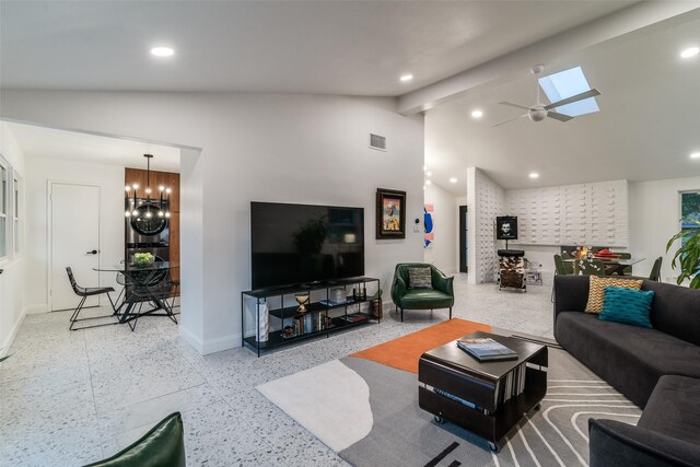 living area with beam ceiling, visible vents, recessed lighting, and baseboards