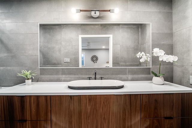 bathroom featuring tile walls and vanity