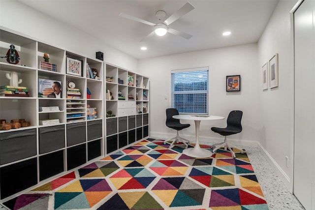 living area with a ceiling fan, recessed lighting, and baseboards