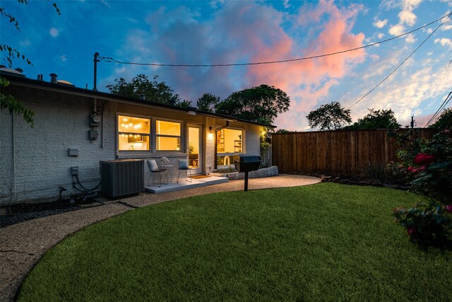 view of yard with cooling unit, a patio, and fence