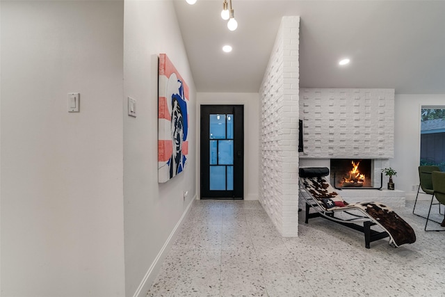 hallway featuring recessed lighting, tile patterned floors, and baseboards