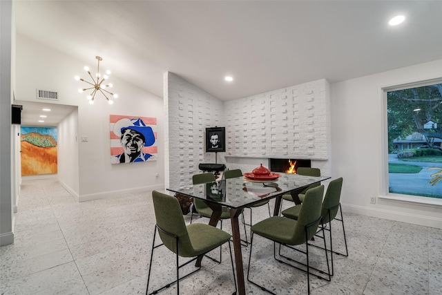 dining room with baseboards, visible vents, a chandelier, and vaulted ceiling