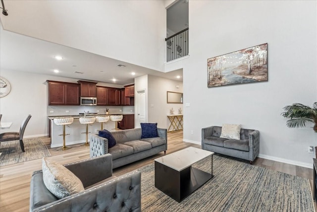 2203 Lannister St, Mansfield, TX 76063 - living room featuring baseboards and light wood-type flooring