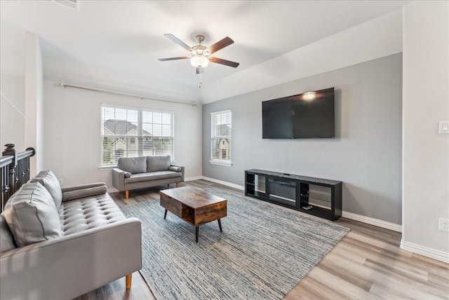 2203 Lannister St, Mansfield, TX 76063 - living room featuring baseboards, ceiling fan, and wood finished floors