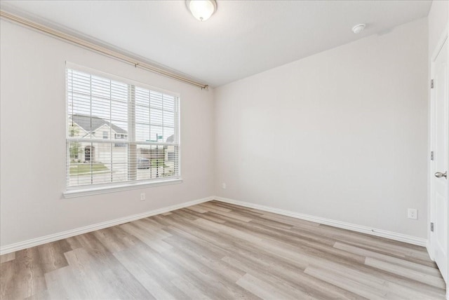 2203 Lannister St, Mansfield, TX 76063 - empty room featuring light wood-type flooring and baseboards