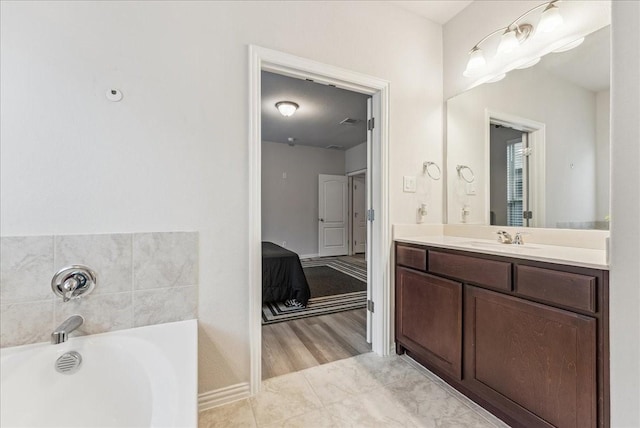 2203 Lannister St, Mansfield, TX 76063 - full bathroom featuring vanity, baseboards, and a garden tub