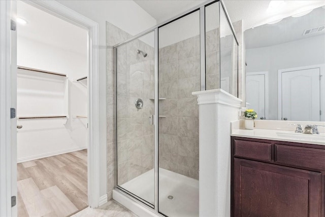 2203 Lannister St, Mansfield, TX 76063 - full bath featuring vanity, a stall shower, a spacious closet, and visible vents