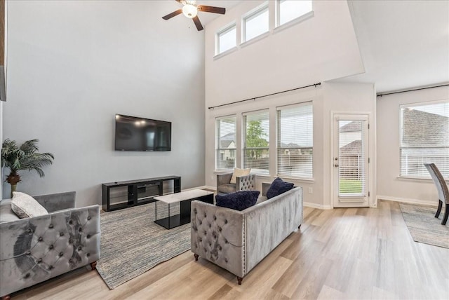 2203 Lannister St, Mansfield, TX 76063 - living room featuring light wood-style floors, baseboards, and ceiling fan