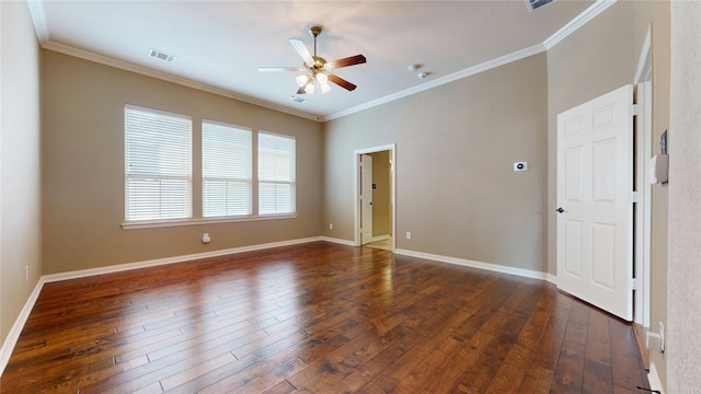 spare room featuring baseboards, ceiling fan, ornamental molding, and visible vents