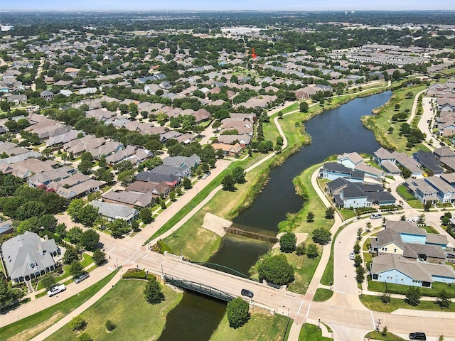 birds eye view of property featuring a water view and a residential view