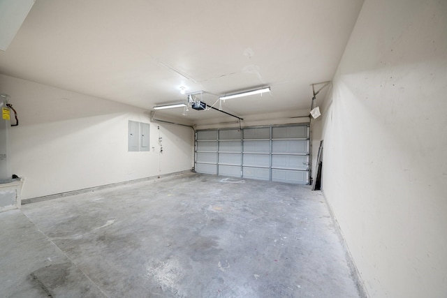 garage featuring a garage door opener and electric panel