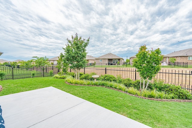 view of yard with a patio, fence private yard, and a residential view