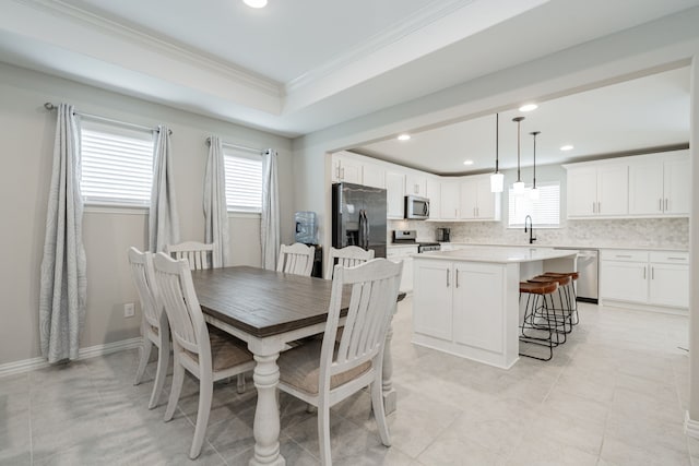 dining room featuring recessed lighting and ornamental molding