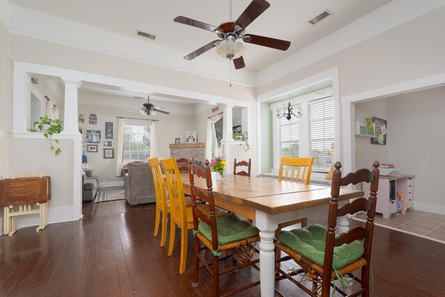 dining area featuring visible vents, ceiling fan, and hardwood / wood-style floors