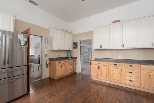 kitchen featuring white cabinetry, dark countertops, visible vents, dark wood-style floors, and freestanding refrigerator