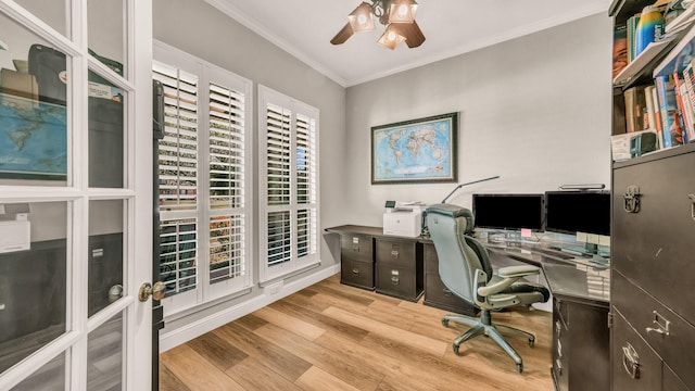 office space with baseboards, ornamental molding, a ceiling fan, and wood finished floors