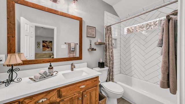 bathroom featuring shower / tub combo, toilet, lofted ceiling, and vanity