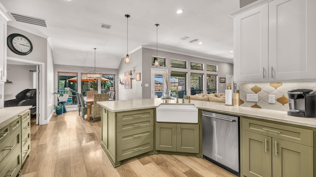 kitchen featuring visible vents, green cabinetry, and stainless steel dishwasher