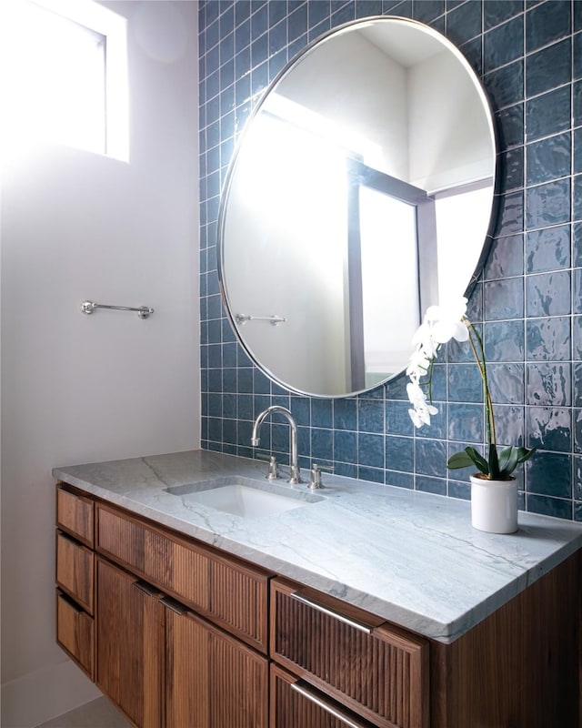6814 Glendora Ave, Dallas, TX 75230 - bathroom with vanity and tasteful backsplash