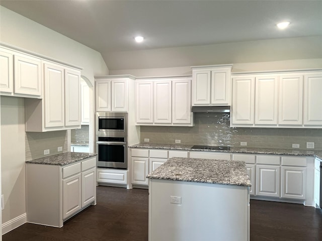 39 Magpie, Joshua, TX 76058 - kitchen featuring appliances with stainless steel finishes, white cabinets, backsplash, dark wood finished floors, and recessed lighting