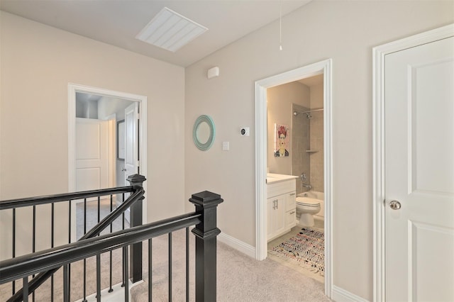 6246 Rilla St, Frisco, TX 75035 - hallway with an upstairs landing, light carpet, and baseboards