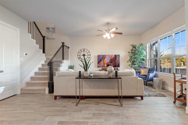 6246 Rilla St, Frisco, TX 75035 - living room featuring ceiling fan, light wood finished floors, and stairs