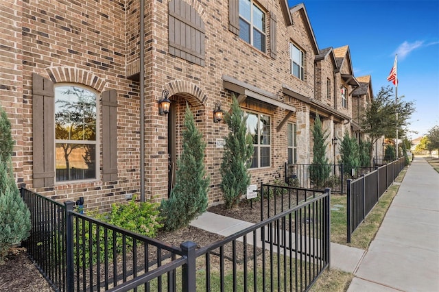 6246 Rilla St, Frisco, TX 75035 - doorway to property featuring fence and brick siding