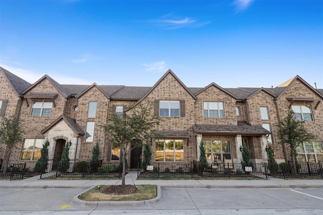 6246 Rilla St, Frisco, TX 75035 - multi unit property featuring brick siding, a shingled roof, and a fenced front yard