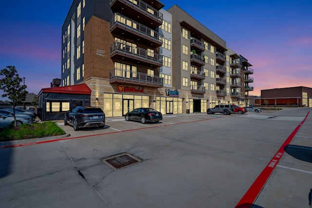 view of property with uncovered parking