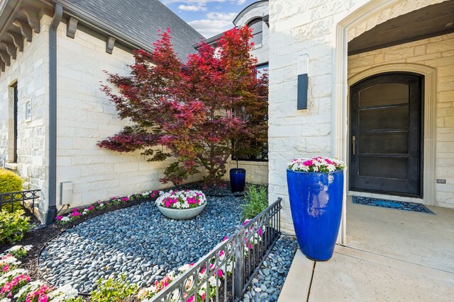 816 Rhone Ln, Southlake, TX 76092 - doorway to property featuring roof with shingles
