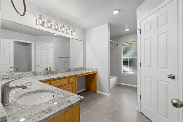 full bathroom with  shower combination, a sink, tile patterned floors, and double vanity