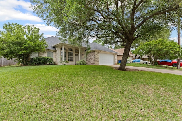 ranch-style house with fence, a front lawn, concrete driveway, an attached garage, and a shingled roof